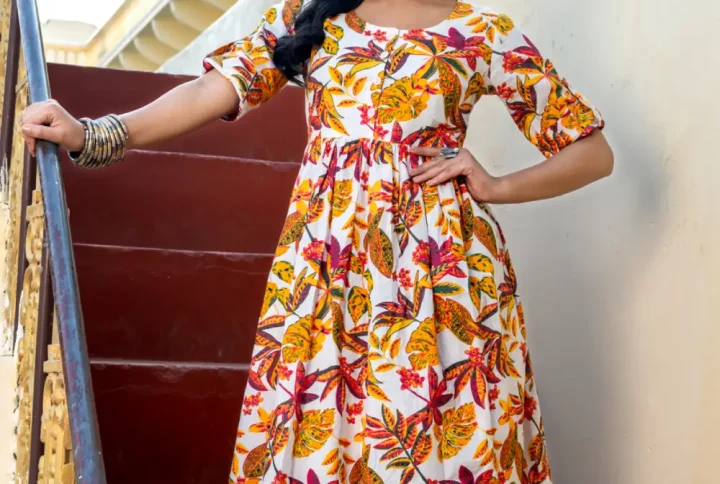 Step into effortless elegance with our Phool Baag Cotton Printed Dress – a floral daydream crafted in soft cream and multicolour hues. Designed with a breezy flared silhouette, this dress combines comfort and charm in perfect balance. The playful floral print adds a touch of freshness, making it a wardrobe essential for your casual outings, brunch dates, or relaxed day events.