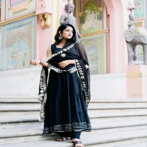 Black Rayon Gotapatti 4-Tier Suit with Dupatta (Without Pant) Grace your festive and special occasions with this Black Rayon Gotapatti 4-Tier Suit, a timeless piece that blends elegance with tradition. Crafted from soft and flowy rayon fabric, this suit features a 4-tier flared design beautifully adorned with intricate gotapatti work, adding a festive sparkle to your look.