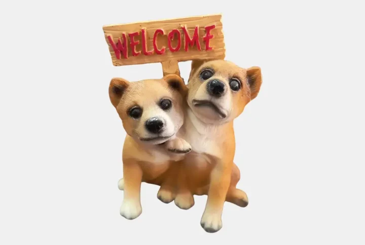Welcome your guests with charm and warmth with this adorable Twin Dog Welcome Showpiece. Crafted from high-quality resin material, this delightful decorative piece features two cute pups holding a wooden-style “WELCOME” sign, making it a perfect addition to your entrance table, reception area, or gifting collection.