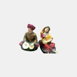 Celebrate the vibrant essence of Rajasthan with this stunning Rajasthani Musical Band Showpiece Set from Pitstop Mart. This handcrafted set features six beautifully dressed traditional male and female musicians, each playing classical Indian instruments like the dholak, manjira, shehnai, and more