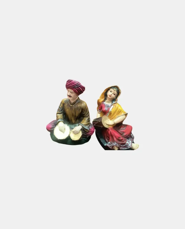 Celebrate the vibrant essence of Rajasthan with this stunning Rajasthani Musical Band Showpiece Set from Pitstop Mart. This handcrafted set features six beautifully dressed traditional male and female musicians, each playing classical Indian instruments like the dholak, manjira, shehnai, and more