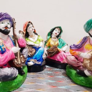Celebrate the vibrant essence of Rajasthan with this stunning Rajasthani Musical Band Showpiece Set from Pitstop Mart. This handcrafted set features six beautifully dressed traditional male and female musicians, each playing classical Indian instruments like the dholak, manjira, shehnai, and more