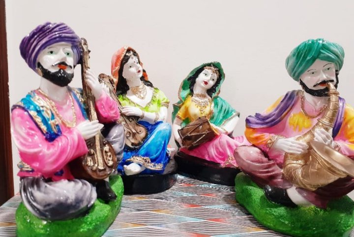 Celebrate the vibrant essence of Rajasthan with this stunning Rajasthani Musical Band Showpiece Set from Pitstop Mart. This handcrafted set features six beautifully dressed traditional male and female musicians, each playing classical Indian instruments like the dholak, manjira, shehnai, and more