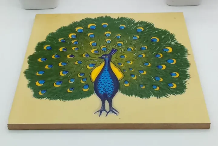 Embrace the vibrant beauty of peacocks with our exquisite collection of hand-painted ceramic tiles. These artisanal tiles, meticulously crafted with passion and precision, are designed to transform your home décor into a captivating haven. Each 6" x 6" tile showcases a mesmerizing peacock motif, inspired by the majestic elegance of these regal birds.