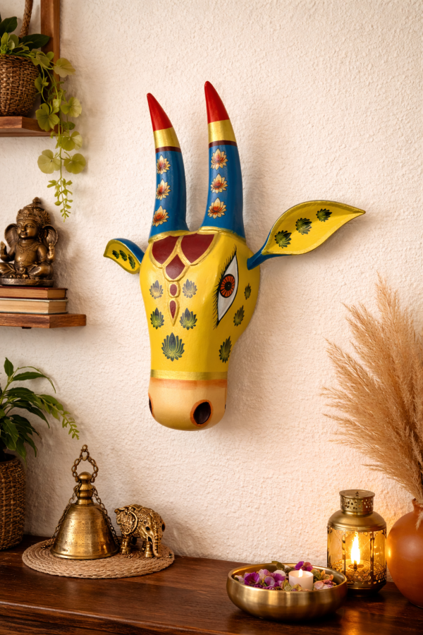 Handcrafted Design: Expertly handcrafted cow head wall hanging inspired by traditional Indian art and culture. Hand-Painted Finish: Decorated with vibrant, long-lasting colors and detailed artwork for an elegant look. Perfect Home Décor: Ideal for living room, pooja room, entrance, office, or any interior wall space. Easy to Hang: Lightweight construction with a convenient hanging provision for quick installation. Ideal for Gifting: A thoughtful choice for housewarming, festive occasions, weddings, and special celebrations. Size: Approx. 15 inch height (minor variations may occur due to handcrafted nature).